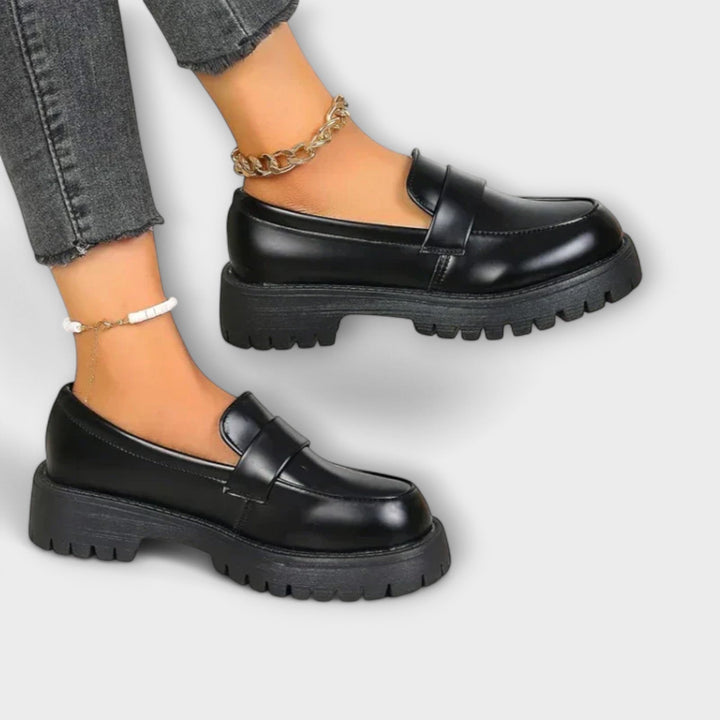 Women's elegant black orthopaedic loafers. Slip-on comfort footwear, ideal for walking and stylish casual use.