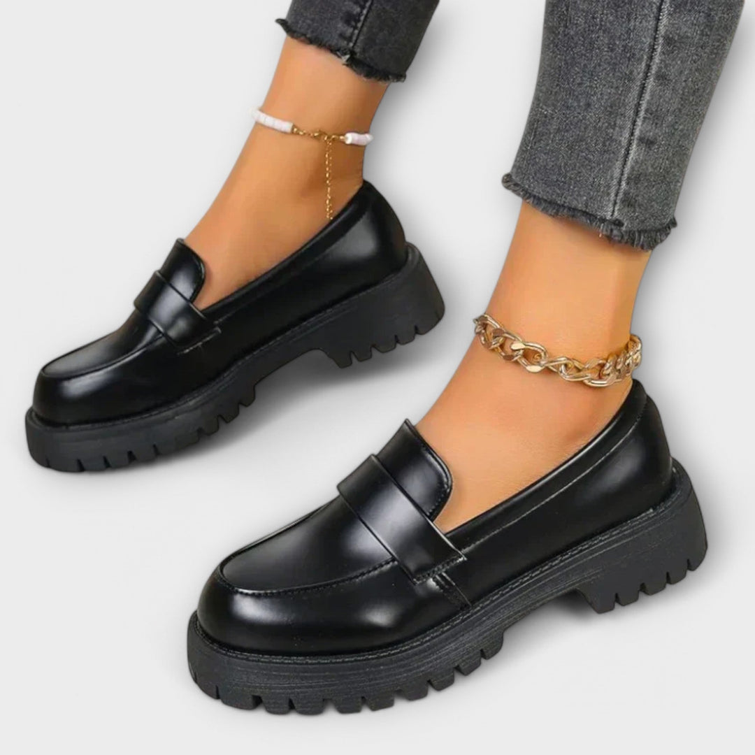 Women's black orthopaedic loafers for all-day comfort & support. Perfect slip-on flats for walking.