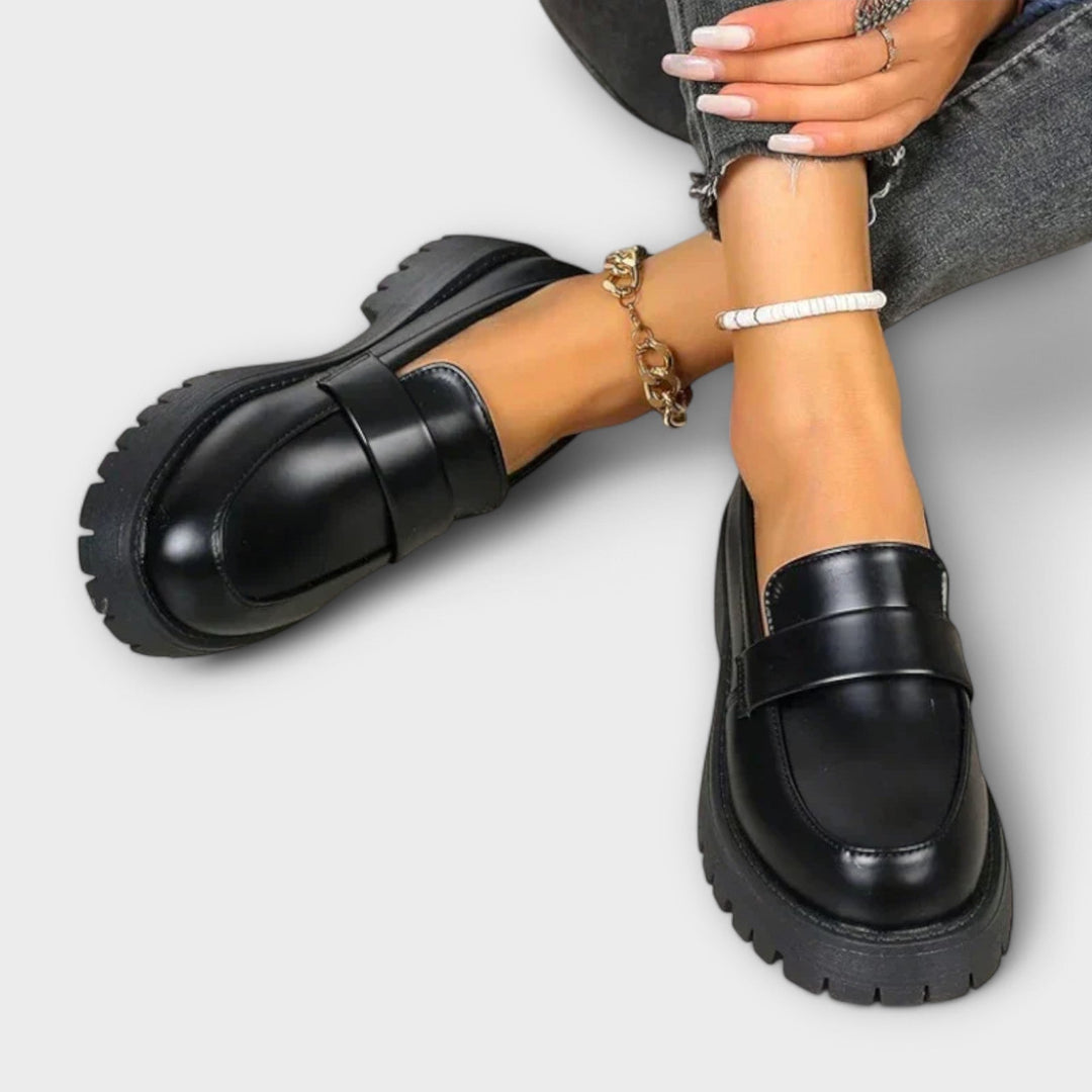 Supportive women's orthopaedic black loafers. Slip-on flats designed for lasting comfort & stability.