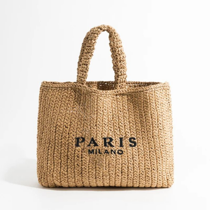 Handwoven straw tote bag for women, ideal as a stylish beach bag or a chic summer accessory. Crochet detailing.
