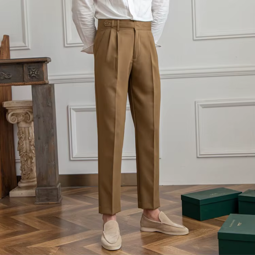 Beige high-waist pleated chinos, perfect for stylish casual menswear looks.