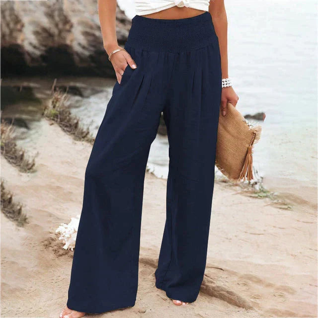 Women's wide-leg comfort pants featuring an elastic waist, designed for elegant movement and relaxed wear.