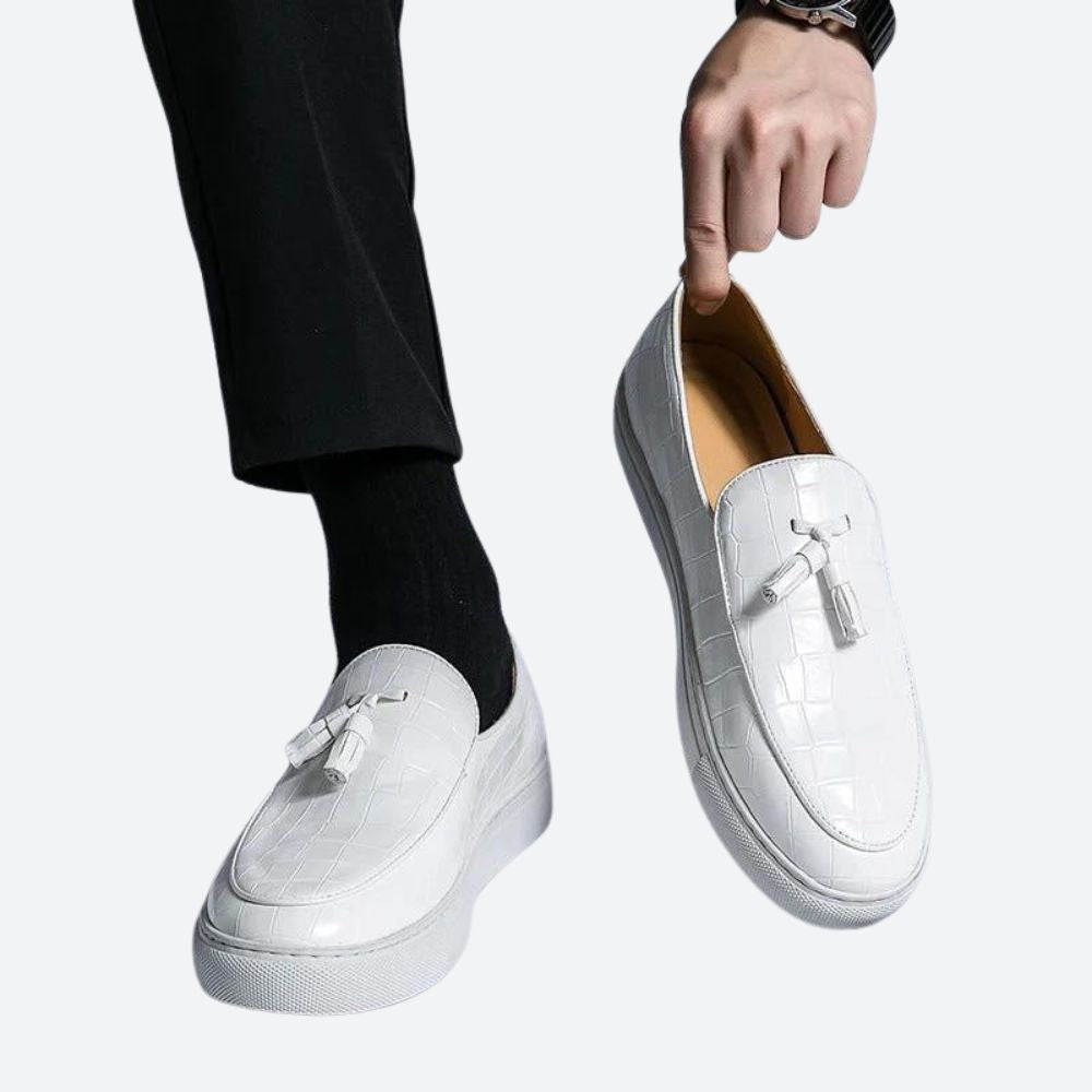 Sophisticated white Italian leather loafers for men. Classic slip-on design, perfect for elegant dress or everyday smart casual wear.