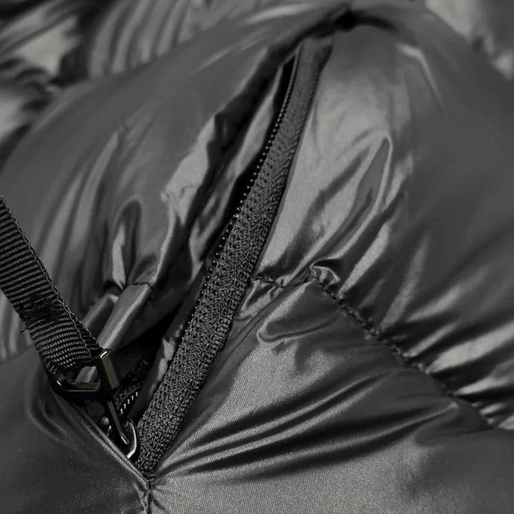 Stylish women's winter outerwear: a sophisticated quilted jacket with hood.