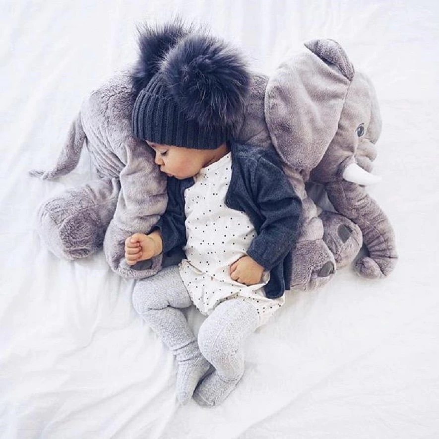 Plush elephant baby pillow, a super soft & safe cuddle toy for newborn comfort & play.