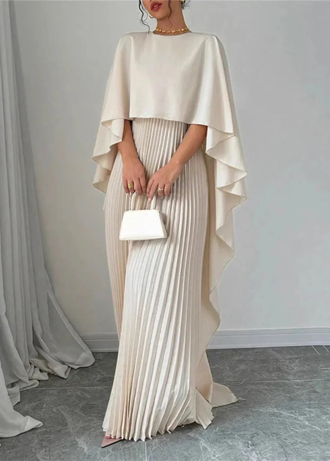 Stylish women's pleated maxi dress with a flowing cape, an elegant choice for formal parties & galas.