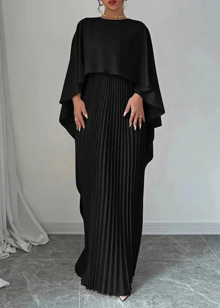 Luxurious women's formal pleated maxi dress featuring a cape, perfect for wedding guests.