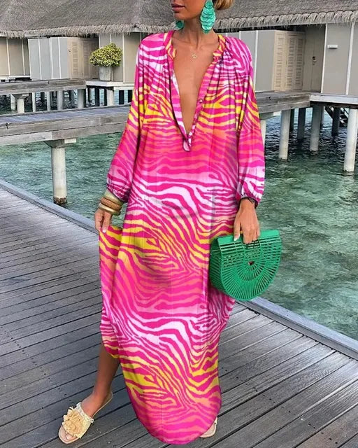 Bohemian V-neck maxi dress for women, with an exotic print, ideal for relaxed summer days or evening events.