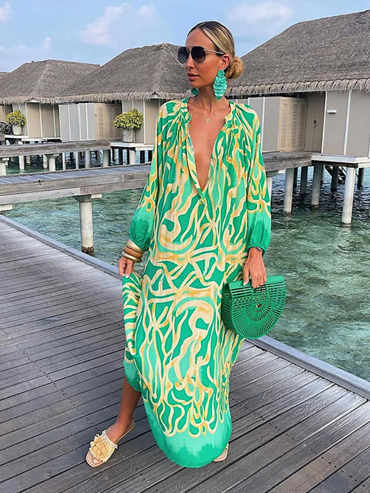 Elegant boho print maxi dress with a flattering V-neck, ideal for summer parties and vintage fashion lovers.