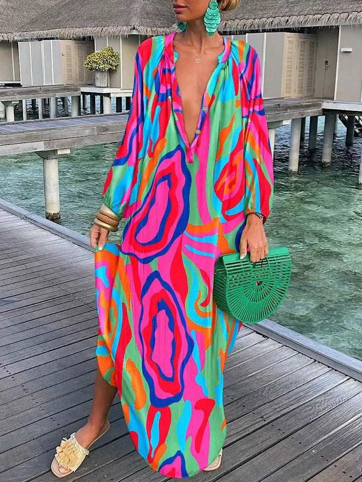 Comfortable summer boho maxi dress with a vibrant print and V-neck, great for beach days or casual outings.