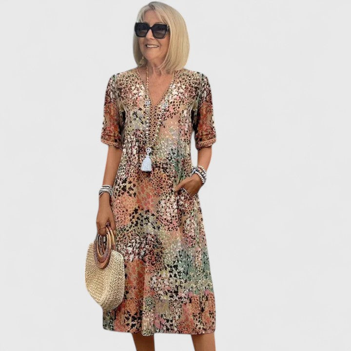 Elegant women's flowy midi dress, perfect for summer occasions. Stylish & comfortable day to night wear.