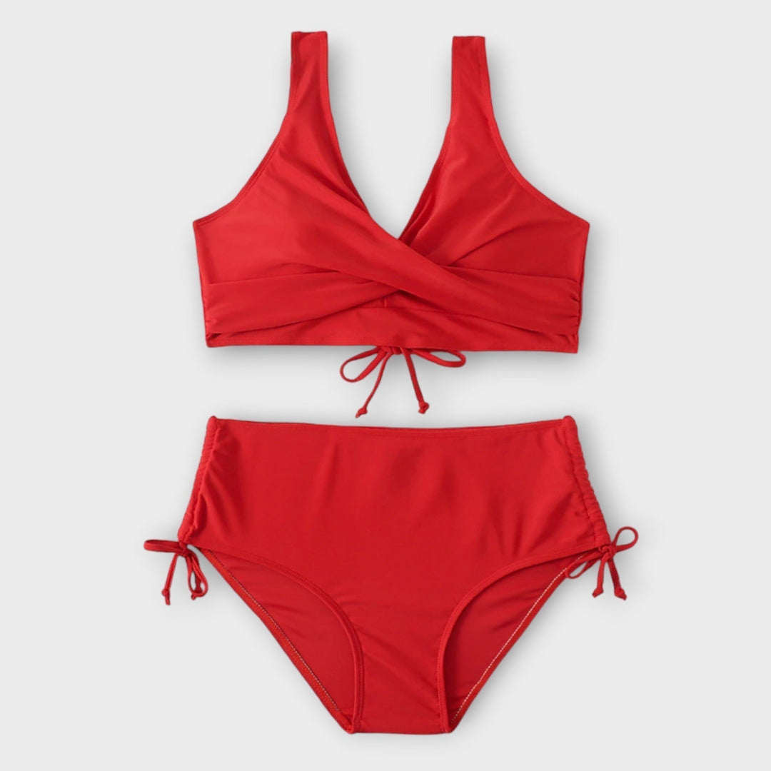 Red women's two-piece bikini swimsuit, stylish beachwear for summer fashion & vacation.