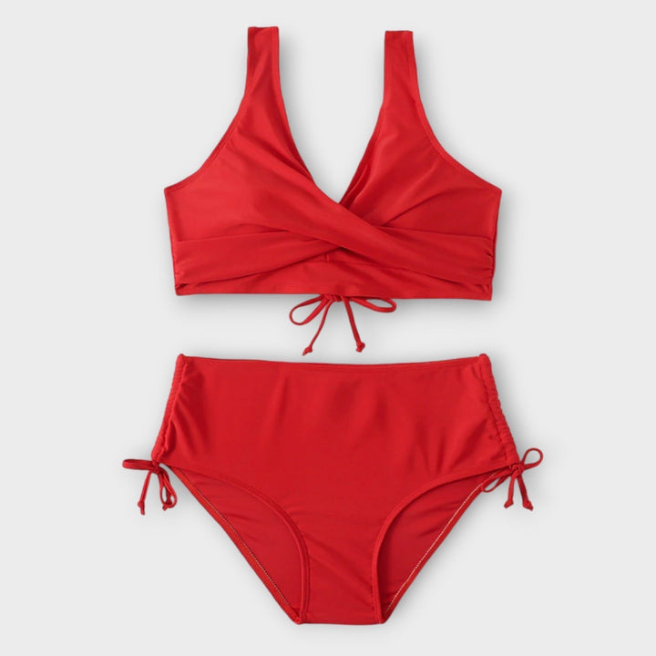 Red women's two-piece bikini swimsuit, stylish beachwear for summer fashion & vacation.