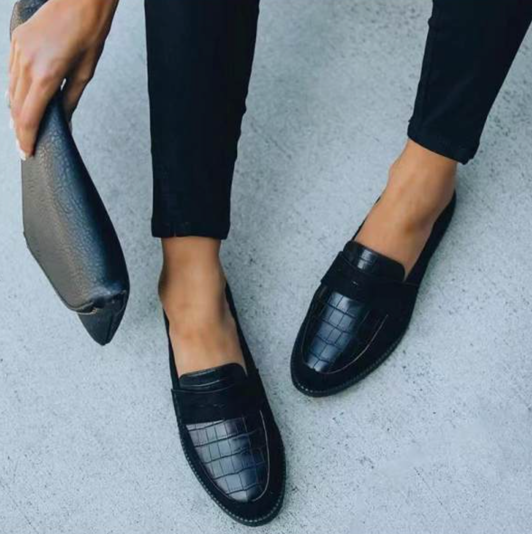 Fashionable women's slip-on loafers, showcasing modern spring/summer style. Comfortable and stylish casual shoes.