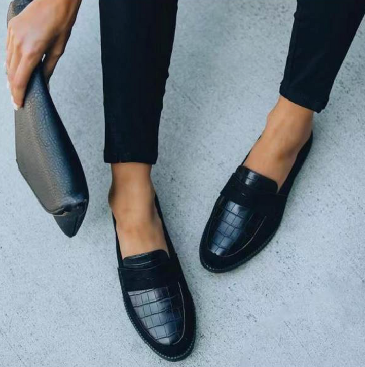 Fashionable women's slip-on loafers, showcasing modern spring/summer style. Comfortable and stylish casual shoes.