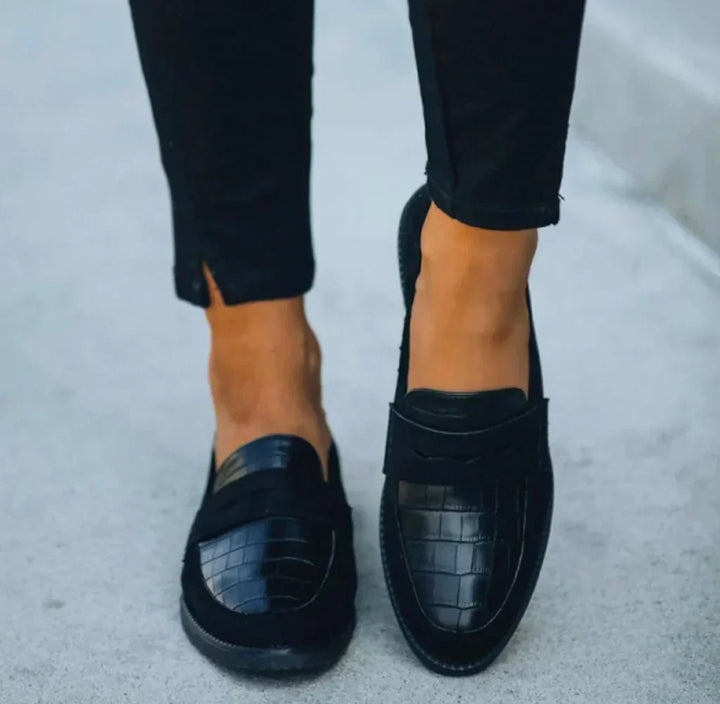 Effortless black slip-on loafers for women, ideal for daily comfort, smart casual style, and versatile fashion footwear.