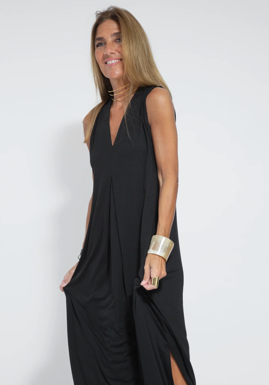 Versatile women's long slimming maxi dress worn solo, perfect for casual chic or semi-formal events.