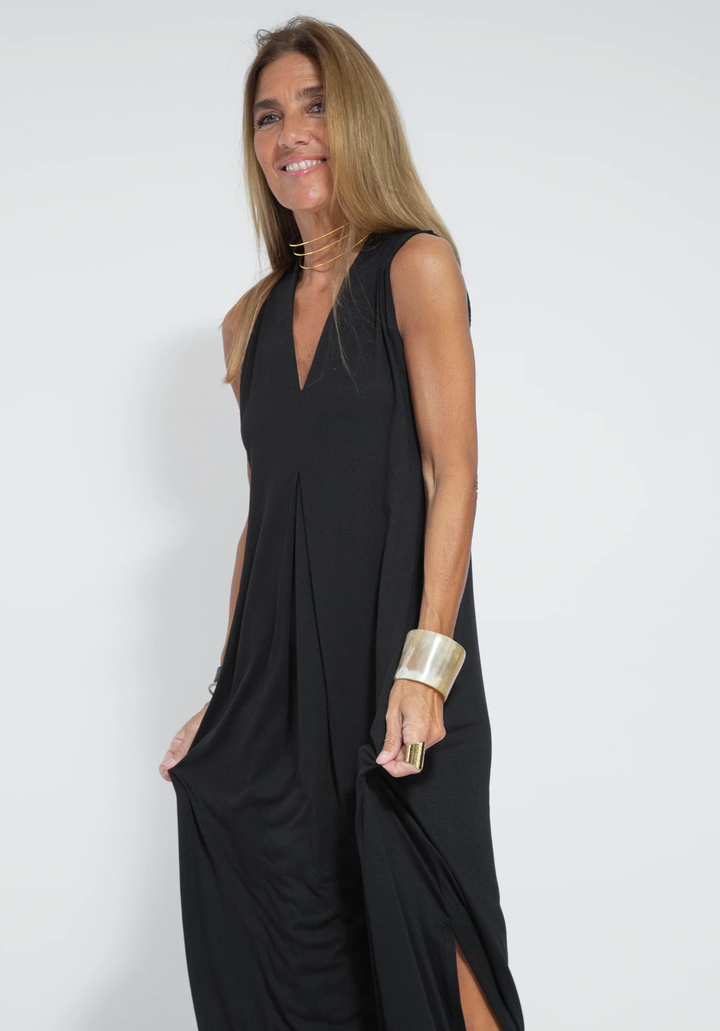 Versatile women's long slimming maxi dress worn solo, perfect for casual chic or semi-formal events.