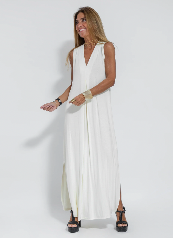 Model in women's two-piece long dress & vest set, showing elegant flow & comfortable movement.