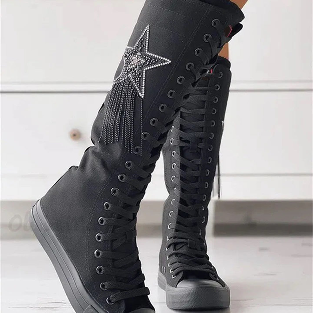 Women's stylish lace-up ankle boots with decorative tassels, perfect for autumn fashion.