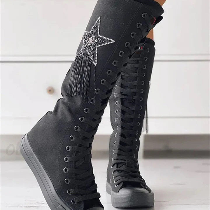 Women's stylish lace-up ankle boots with decorative tassels, perfect for autumn fashion.