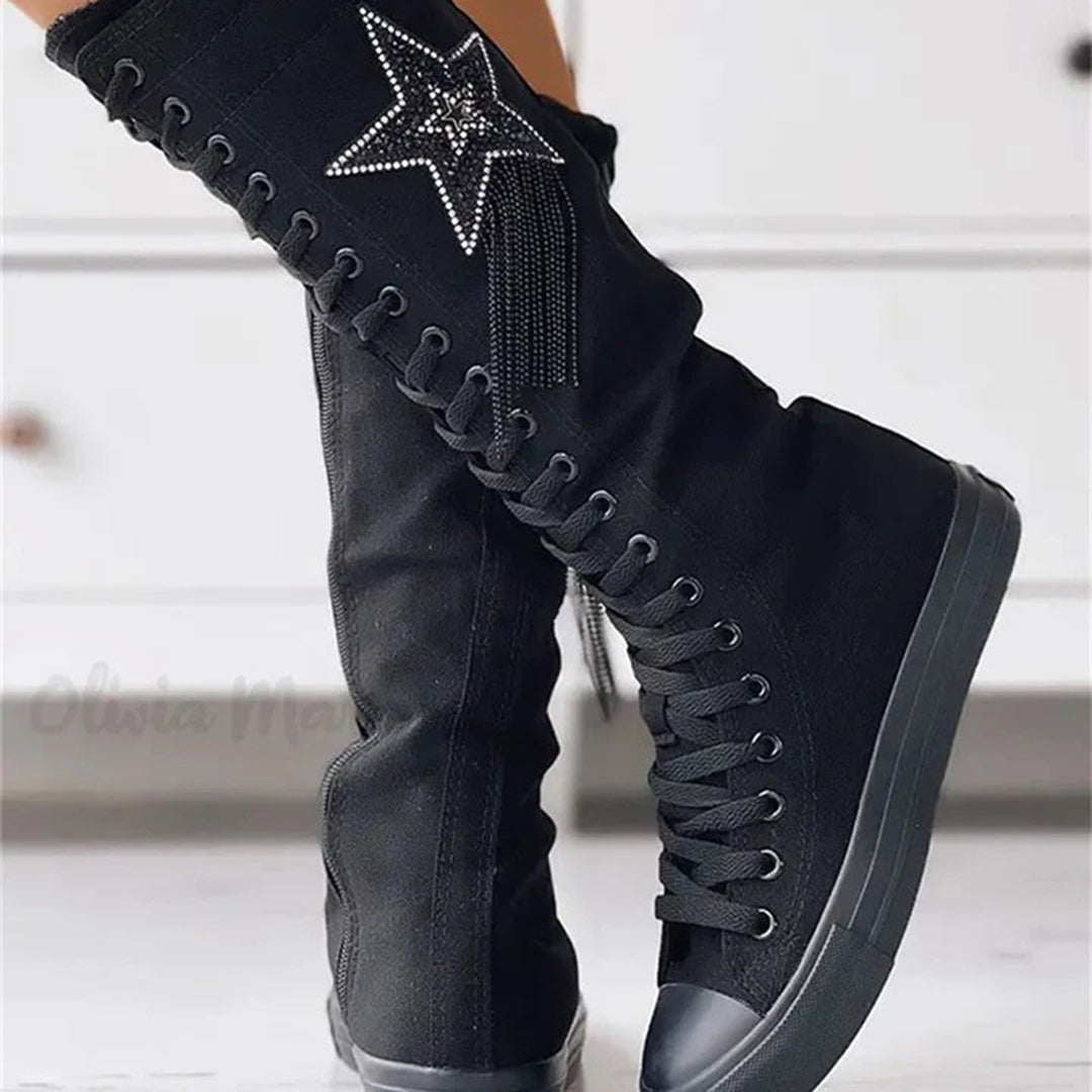 Chic women's lace-up boots with tassels, offering comfort & style for winter footwear.