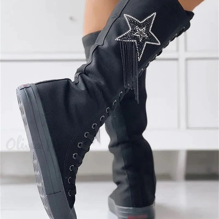 Elegant women's ankle boots featuring lace-up design & tassels, ideal for casual autumn outfits.