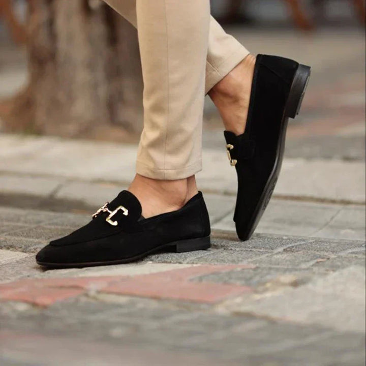 Versatile men's slip-on loafers for work, formal events & smart casual style. Features a distinctive metal buckle.