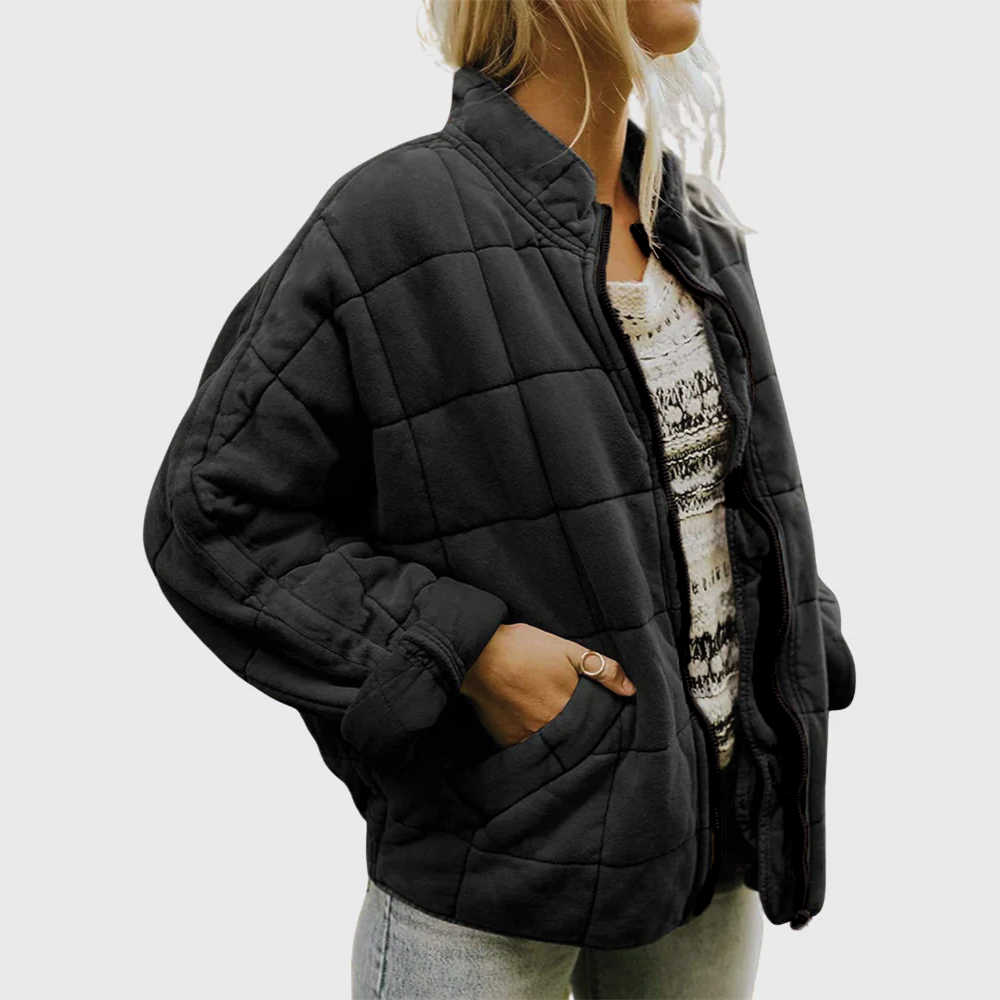 Stylish women's oversized quilted zip jacket in black, a warm & cozy outerwear for fall & winter fashion.