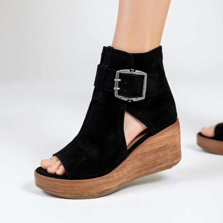 Black women's open toe wedge ankle boots with stylish design. Perfect for confident comfort & versatile fashion.