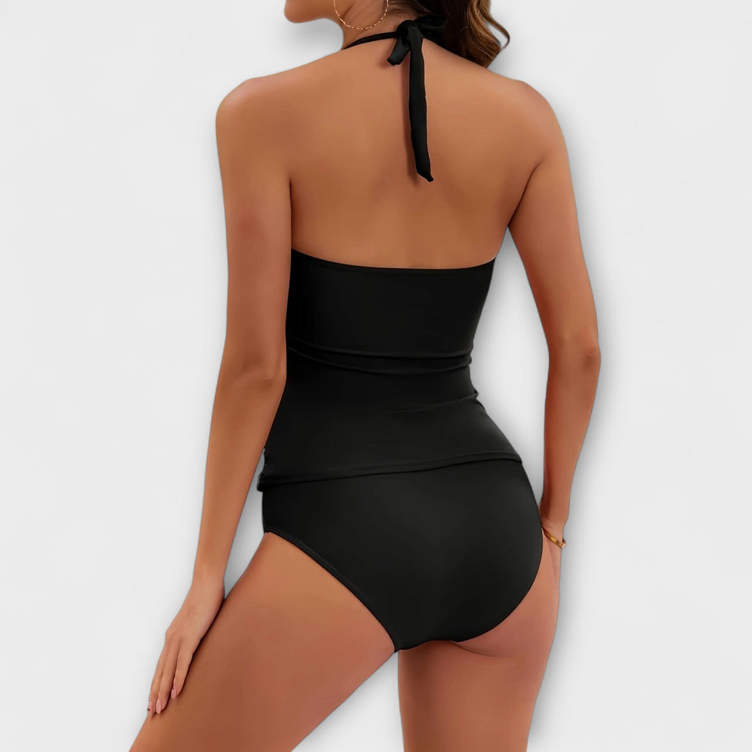 Chic two-piece solid halter swimsuit for women. Essential summer beach and pool attire.