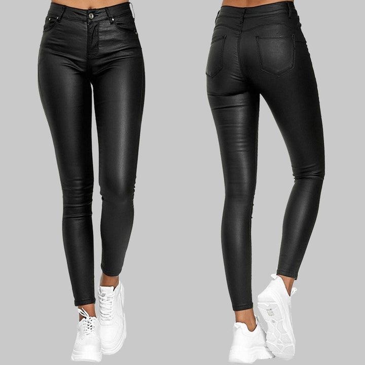 Red sleek finish slim fit pants. Stretchy high-waisted bottoms, versatile for unisex fashion & comfort.