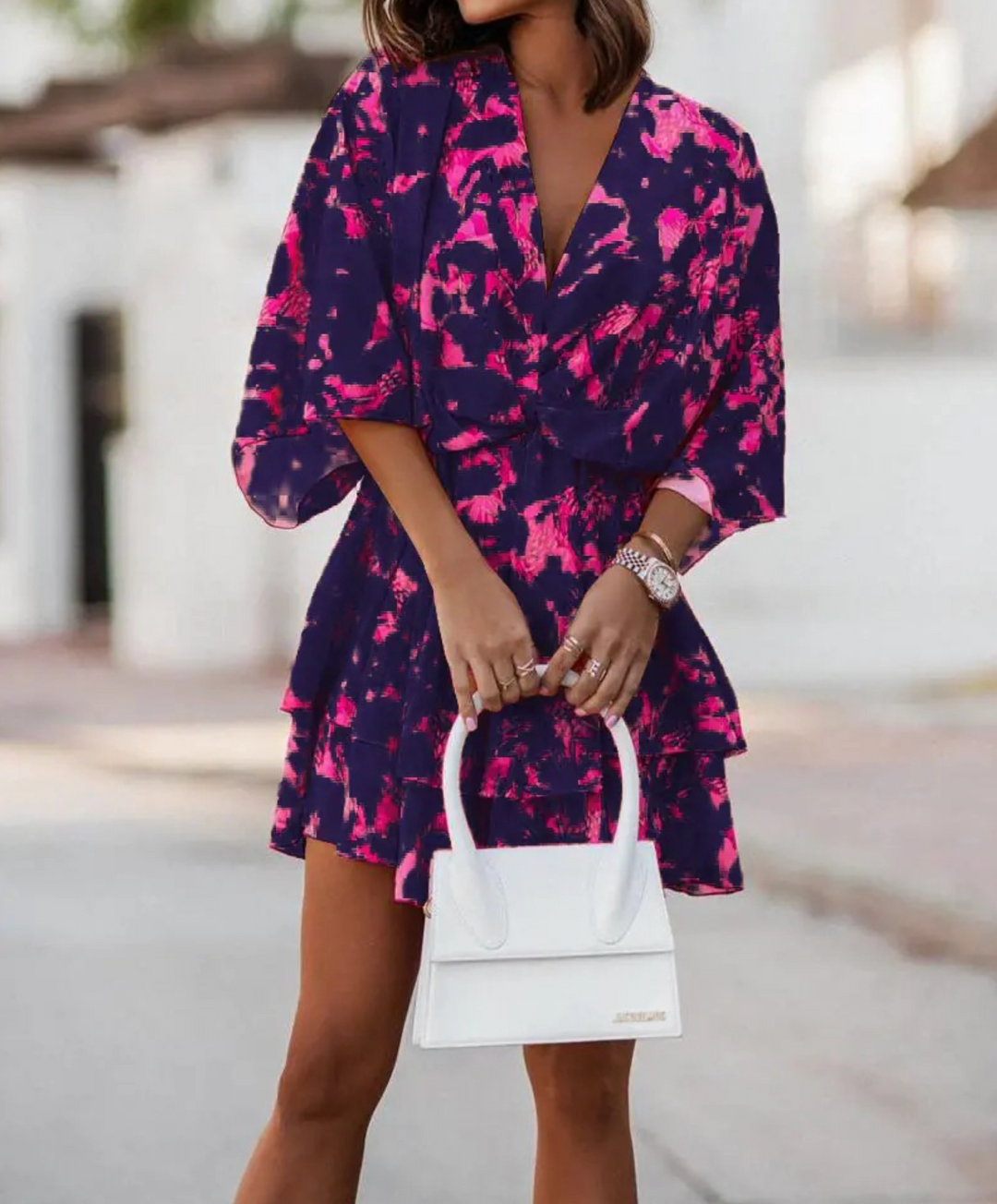 Fashionable women's floral mini dress, bohemian charm with ruffles, suitable for diverse casual looks.