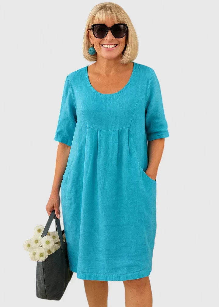 Women's elegant half-sleeve midi dress with scoop neck & pockets. Perfect for versatile spring/summer fashion.