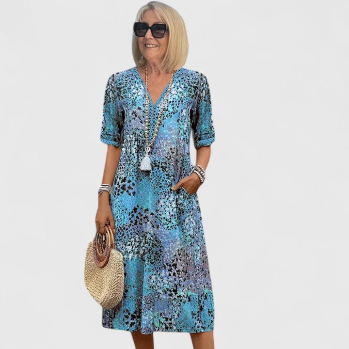 Versatile women's midi dress with an elegant flowy design. Comfortable for day or night, suitable for various occasions.