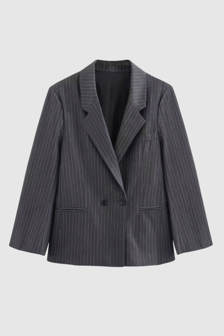 Elegant women's oversized pinstripe blazer with a modern double-breasted fit, ideal for professional attire.