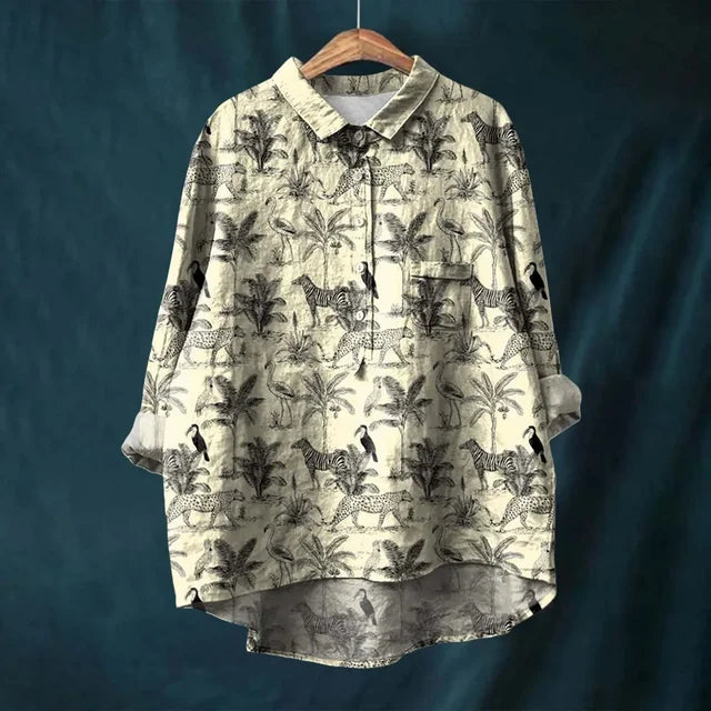 Timeless women's vintage floral top, elegant design with puff sleeves, great for spring/summer style.