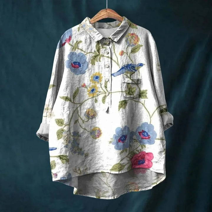 Chic women's vintage floral blouse featuring stylish puff sleeves and a flattering V-neck design.