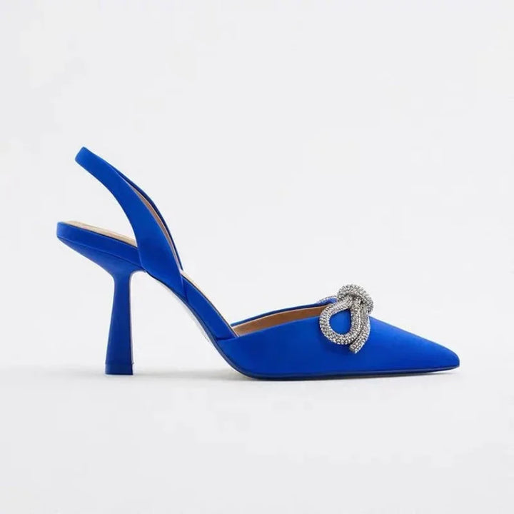 Stylish black pointed toe high heels with a chic bow, ideal women's dress or party sandals for summer.