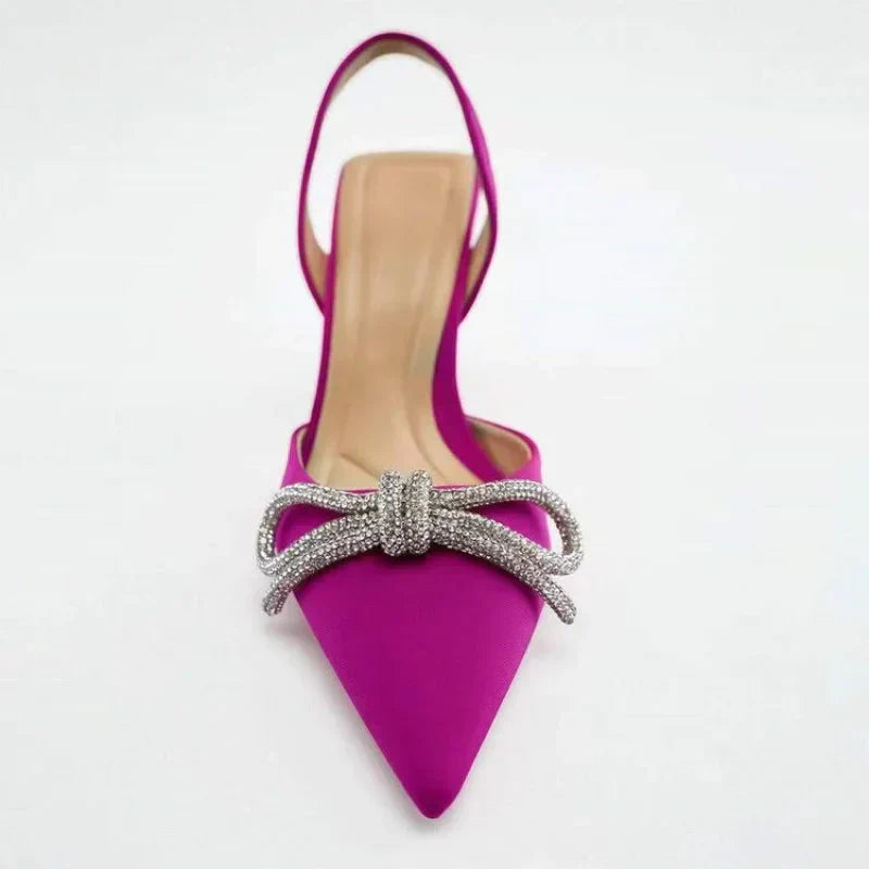 Elegant blue high heel sandals for women, featuring a pointed toe and decorative bow. Perfect for summer parties.