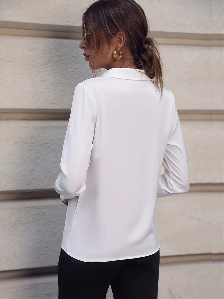 Stylish women's long sleeve collared blouse, offering a professional and elegant look for formal attire.