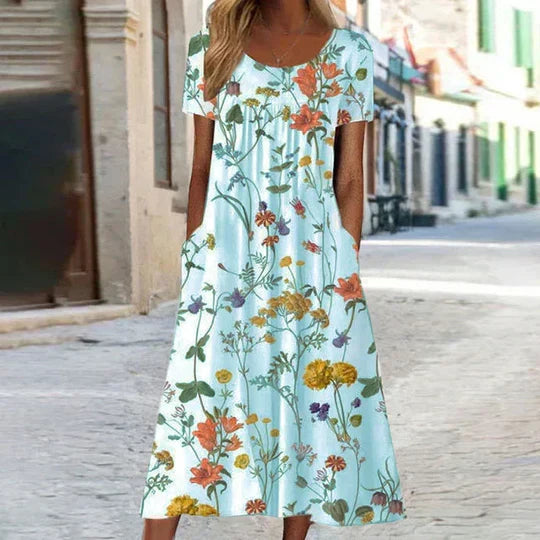 Elegant women's midi summer dress featuring a beautiful floral pattern, perfect for a sophisticated look.