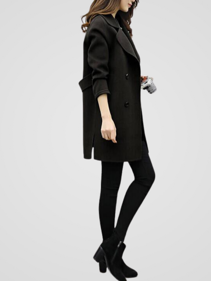 Elegant women's double-breasted longline trench coat, offering a sophisticated & classic style.