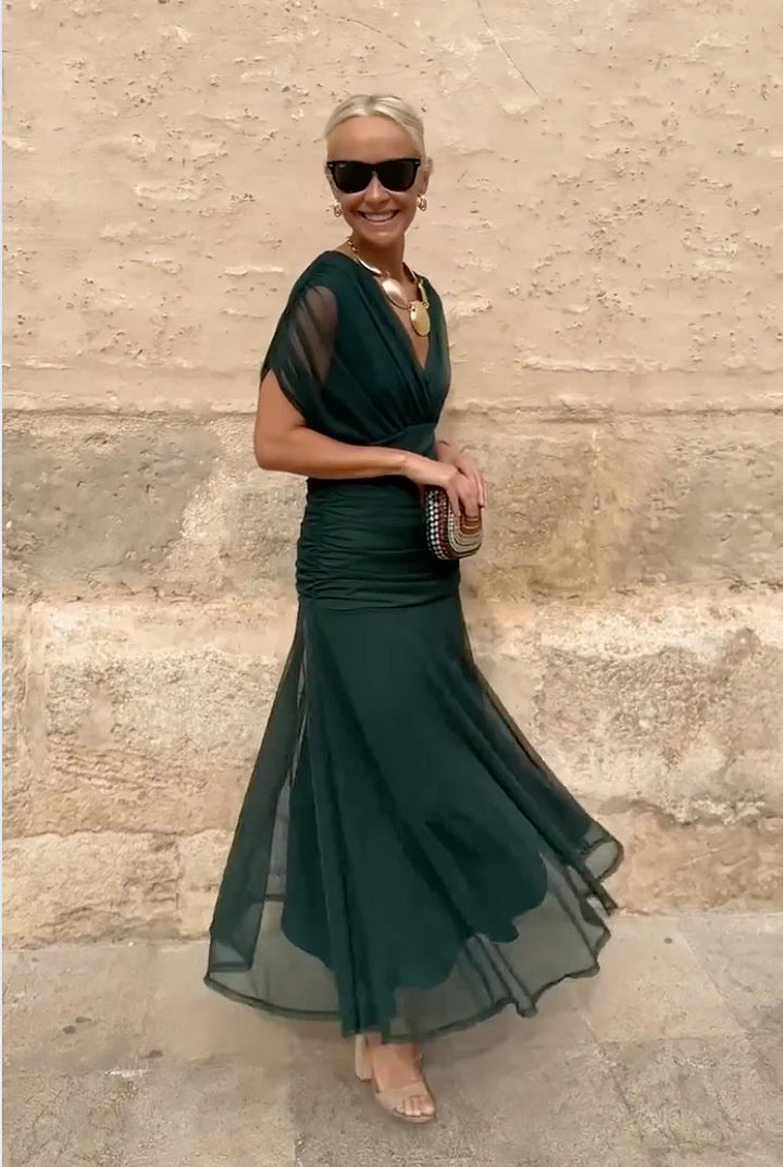 Formal V-neck wrap maxi dress for women, featuring elegant sheer sleeves. Great for evening wear.