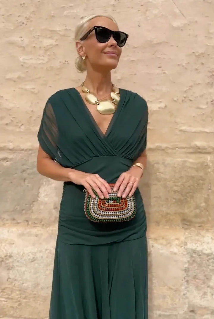 Chic women's V-neck wrap maxi dress with flowy sheer sleeves. Stylish for evening & formal events.