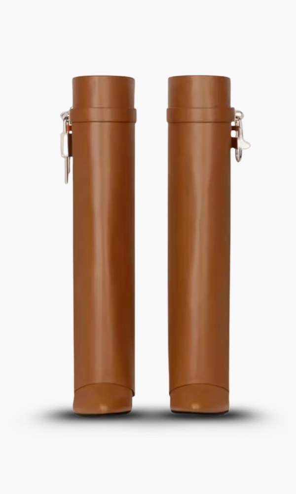 Glossy black women's wedge boots, knee-high with a sculptural design, for bold statement footwear.