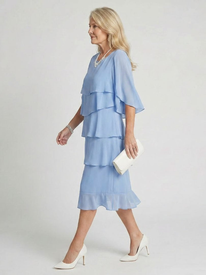 Chic women's short sleeve midi dress, flowing tiered design, perfect for casual summer outings.