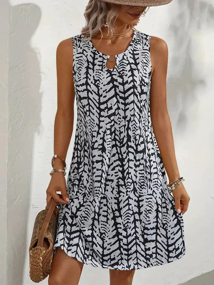 Women's sleeveless summer mini dress, perfect for casual wear & warm days.