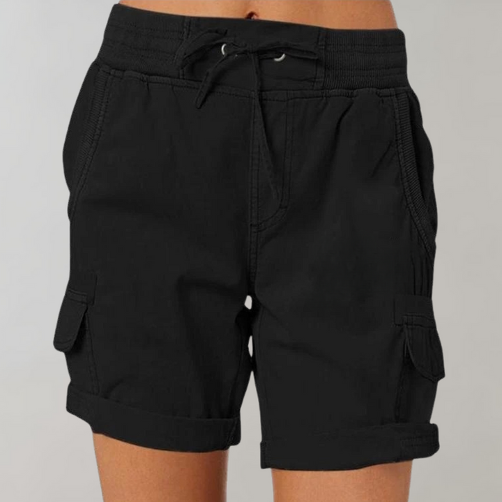 Fashionable women's high waist cargo shorts styled for a chic summer look, offering both comfort and modern style.