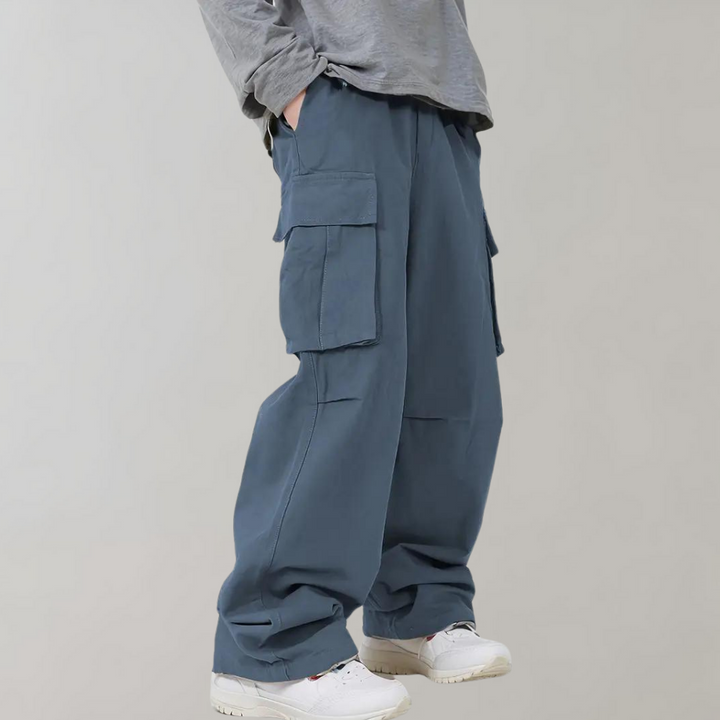 Men's oversized cargo pants with practical utility pockets for storage & casual style.